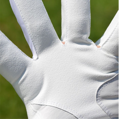 up close image of the vent air holes between the fingers of a Intech Men's Cabretta Leather Golf Glove with a person wearing it