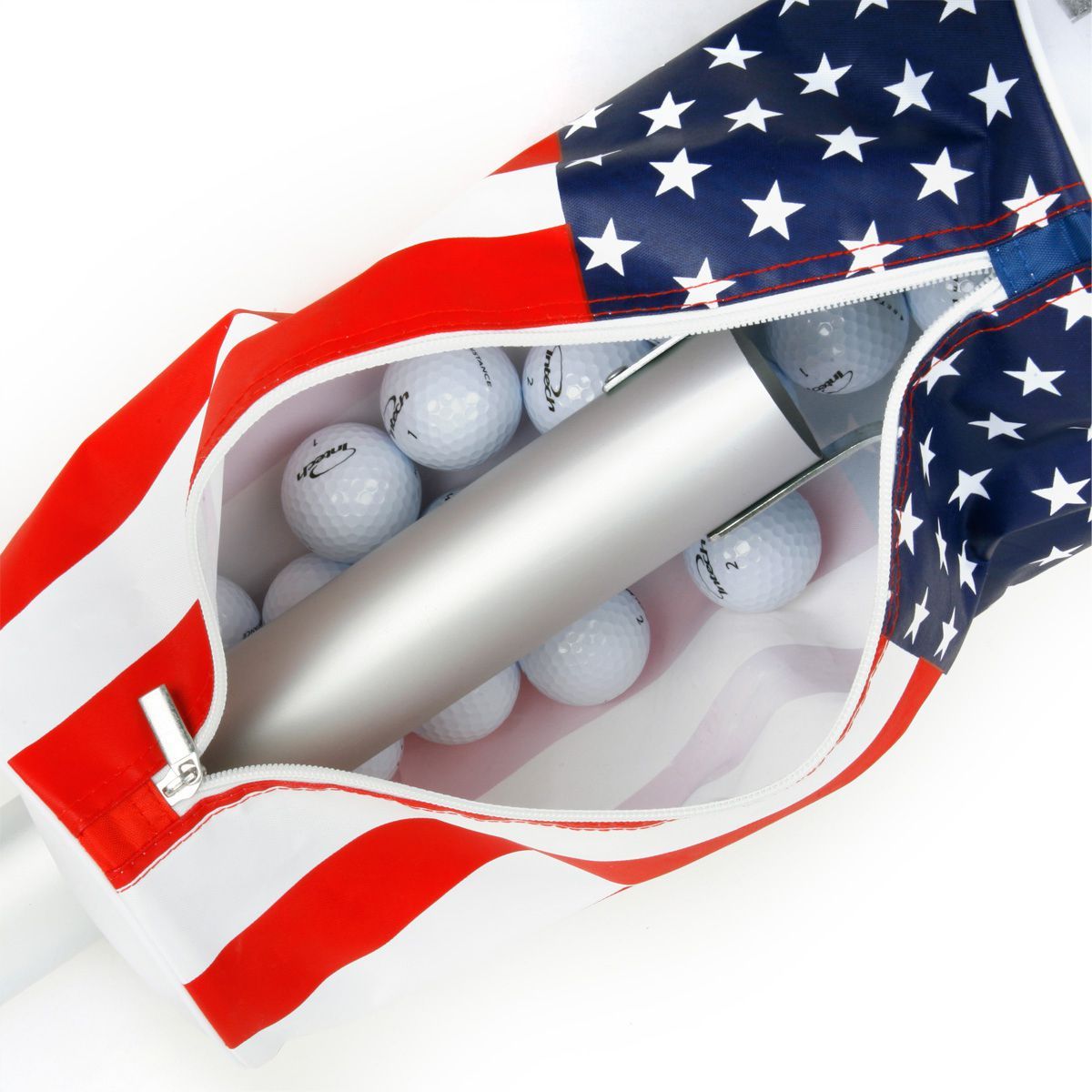 golf balls inside the zippered compartment of the red, white and blue Intech Golf Ball Shag Bag